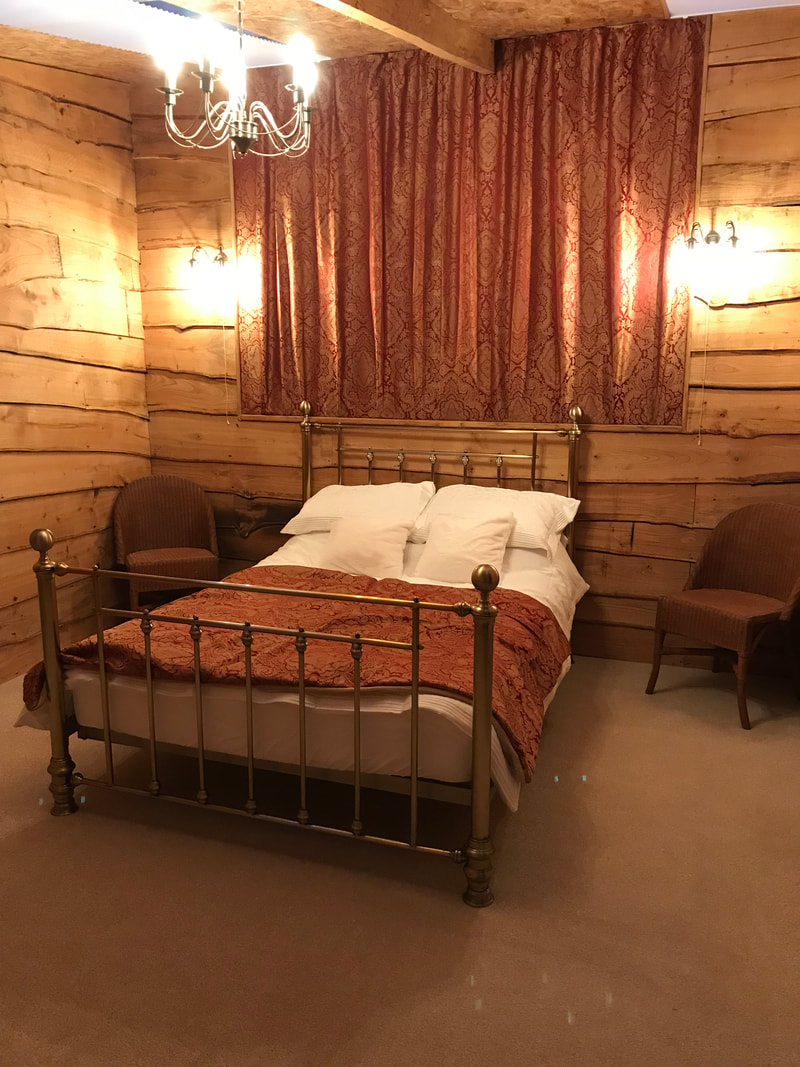 Cosy, romantic luxury in the double bedroom at Daisy Cabin